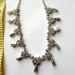 Silver tone necklace with prongs set white rhinestones round and square in shape